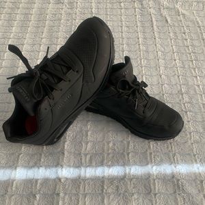 Black Skechers slip resistant work shoes, size 11